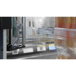 Film width reduction system for securing pallet base